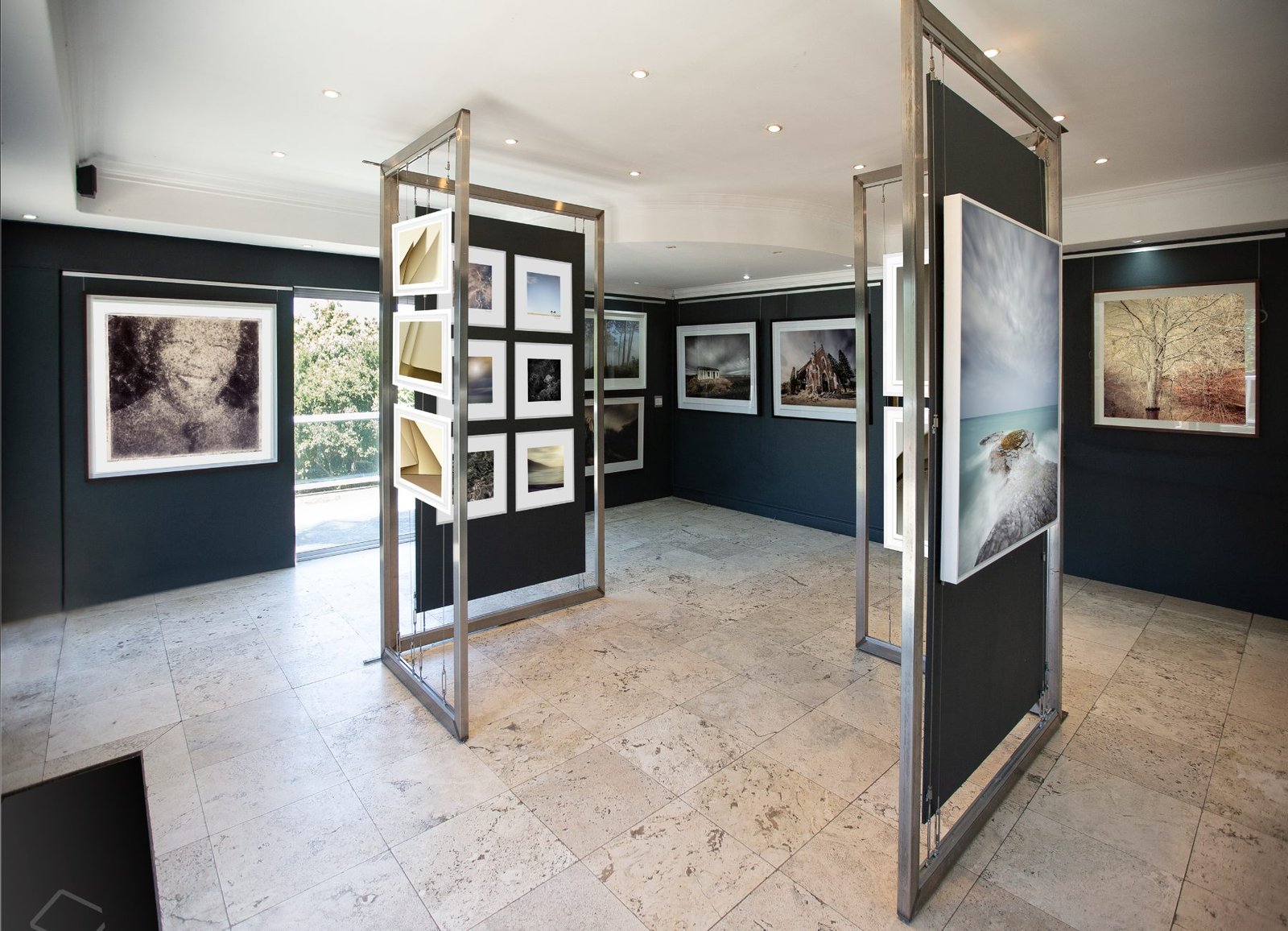 Inside the Osner Gallery building in Hout Bay, framed prints on the walls and on gallery stands