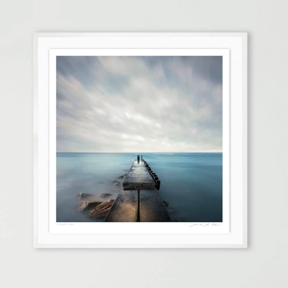 A square seascape in a white box frame